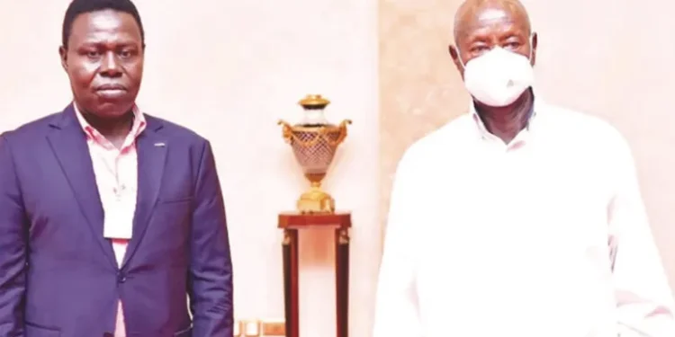 David Ssenfuka (L) and President Museveni