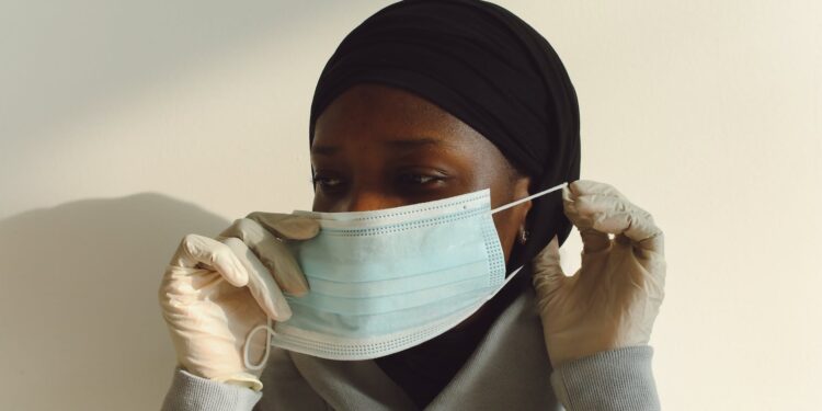 close up photo of woman wearing face mask