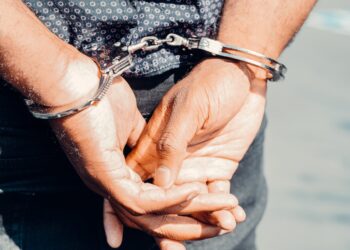 close up photography of person in handcuffs